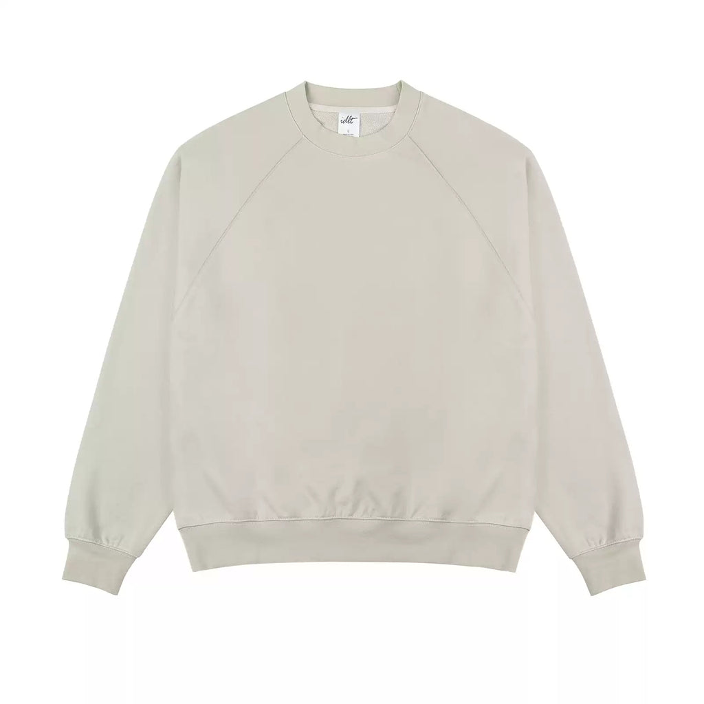 IDLT raglan sweatshirt, cream front laid flat.