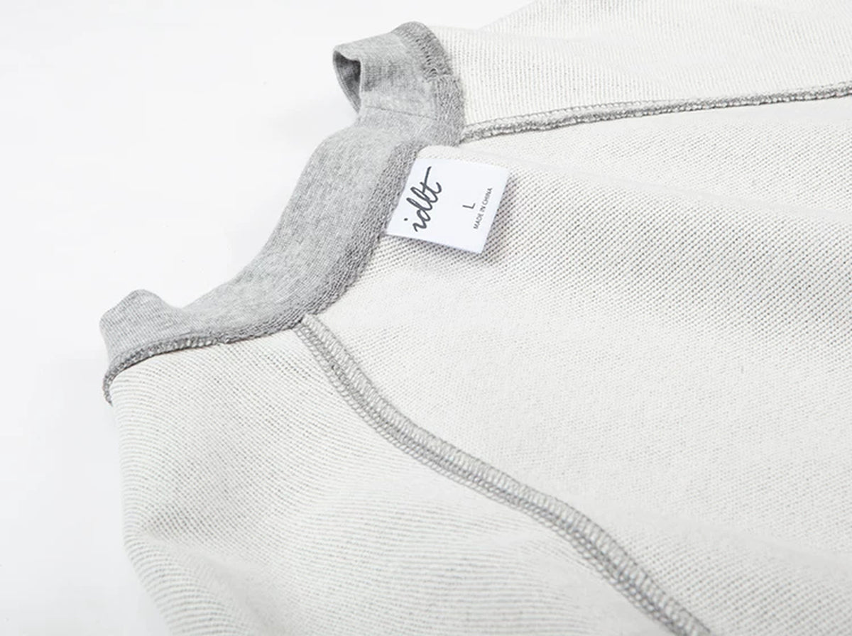 IDLT raglan sweatshirt, heather gray inner neckline and label.