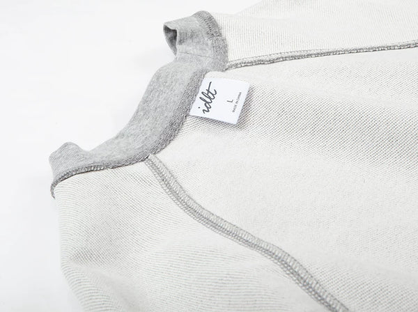 IDLT raglan sweatshirt, heather gray inner neckline and label.