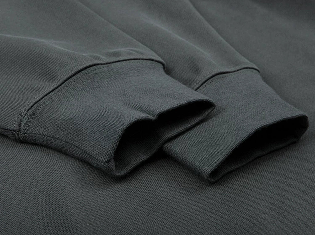 IDLT raglan sweatshirt, dark gray ribbed cuffs.