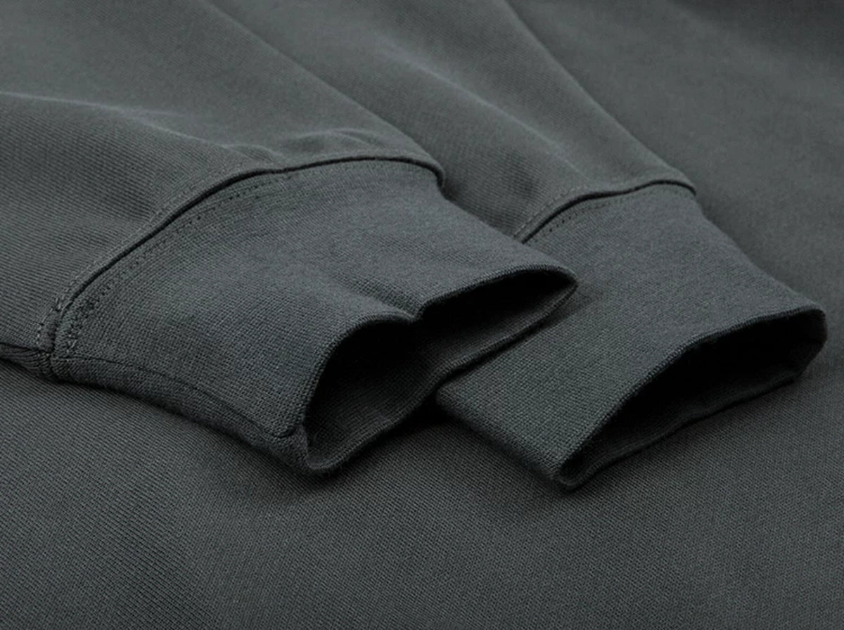 IDLT raglan sweatshirt, dark gray ribbed cuffs.