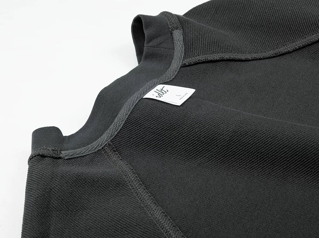 IDLT raglan sweatshirt, dark gray inner neckline and label.