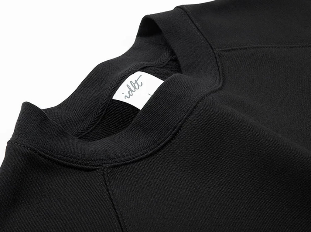 IDLT raglan sweatshirt, black neckline and label.