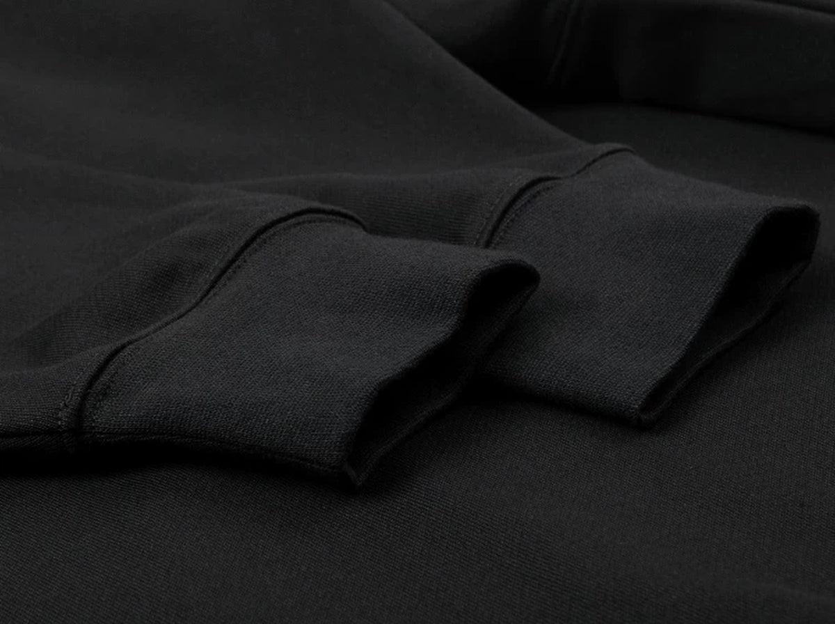 IDLT raglan sweatshirt, black ribbed cuffs.