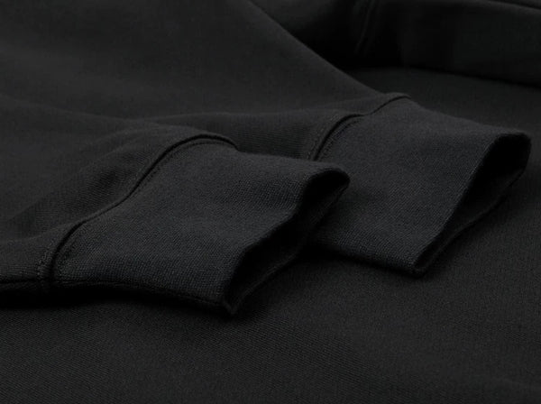 IDLT raglan sweatshirt, black ribbed cuffs.
