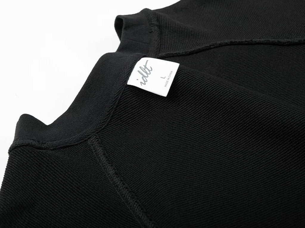 IDLT raglan sweatshirt, black inner neckline and label.