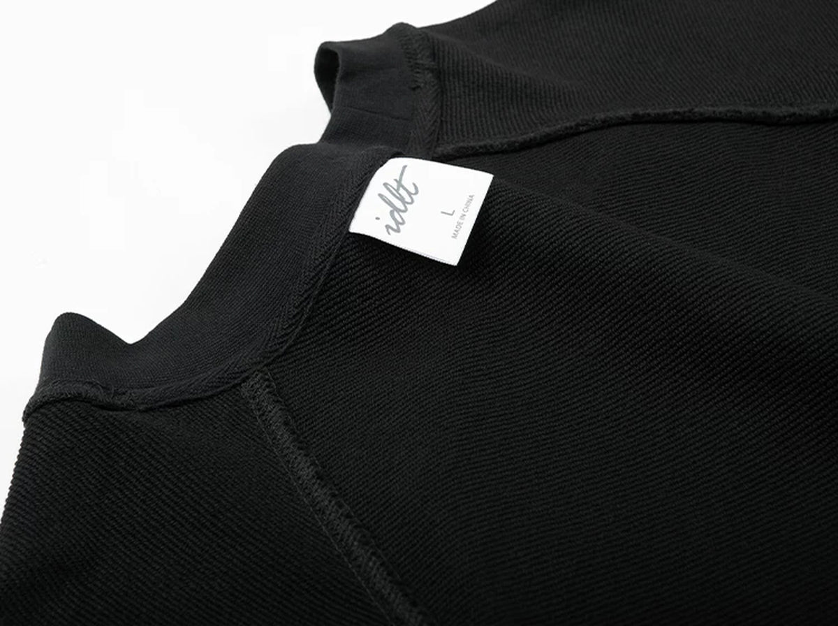 IDLT raglan sweatshirt, black inner neckline and label.