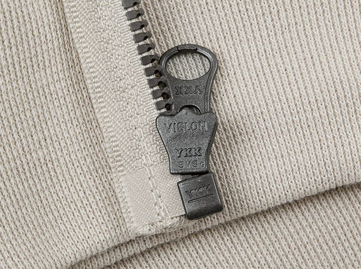IDLT zip hoodie, cream zipper pull.