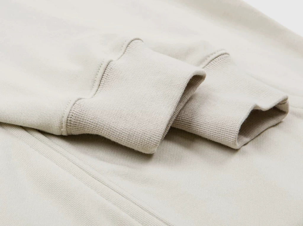 IDLT zip hoodie, cream ribbed cuffs.