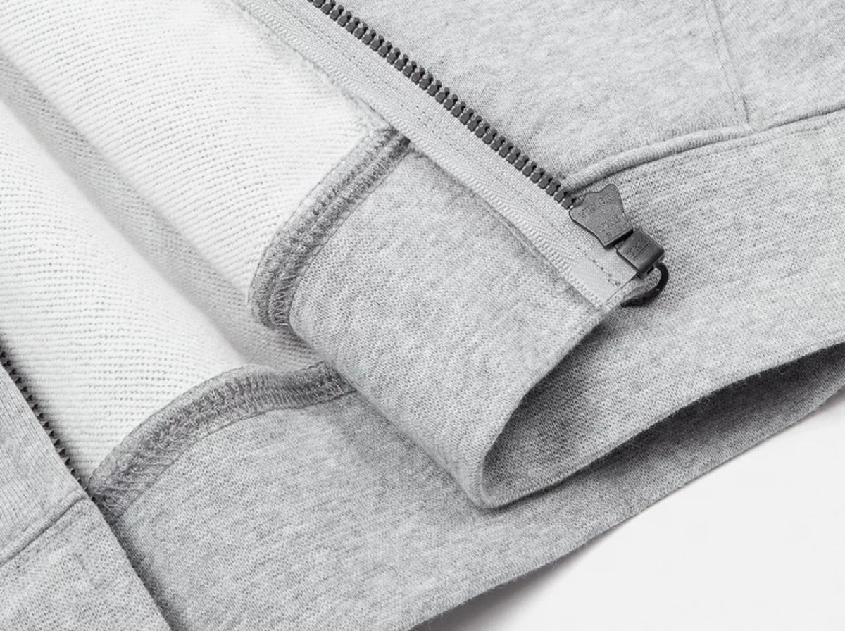 IDLT zip hoodie, heather gray bottom zipper and hem.