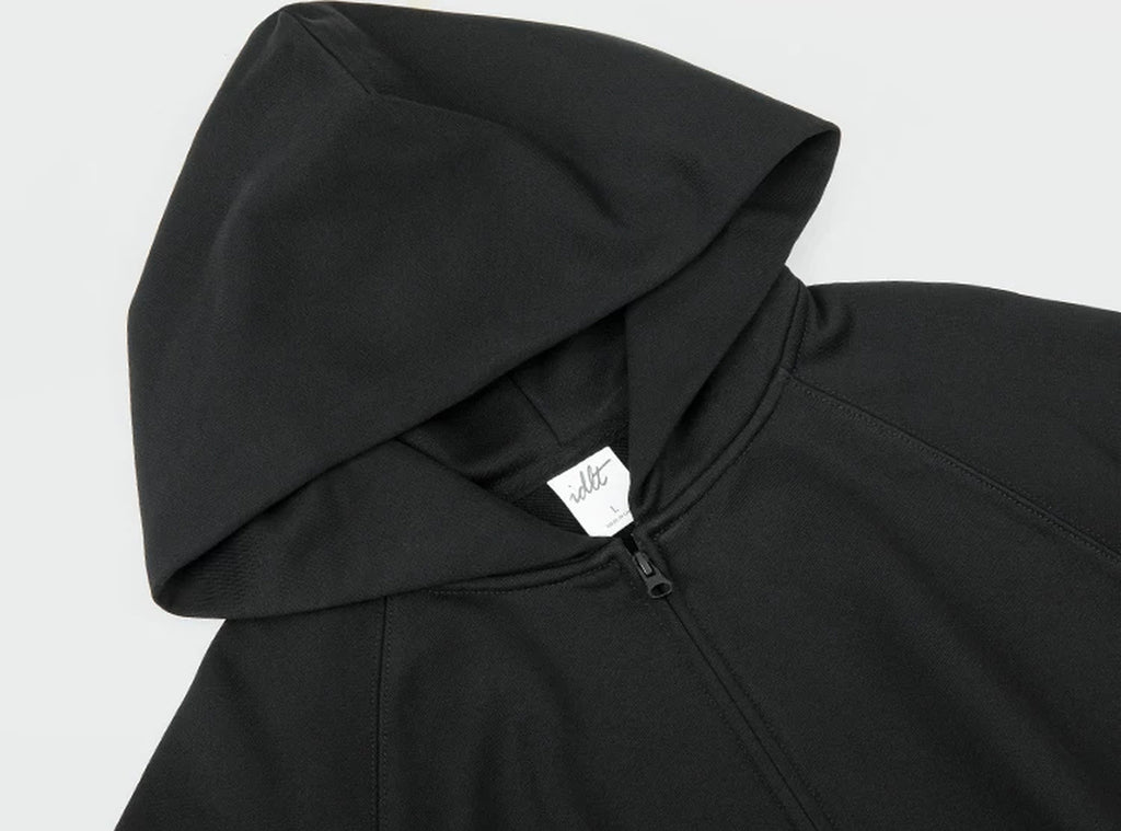 IDLT zip hoodie, black hood and neckline.