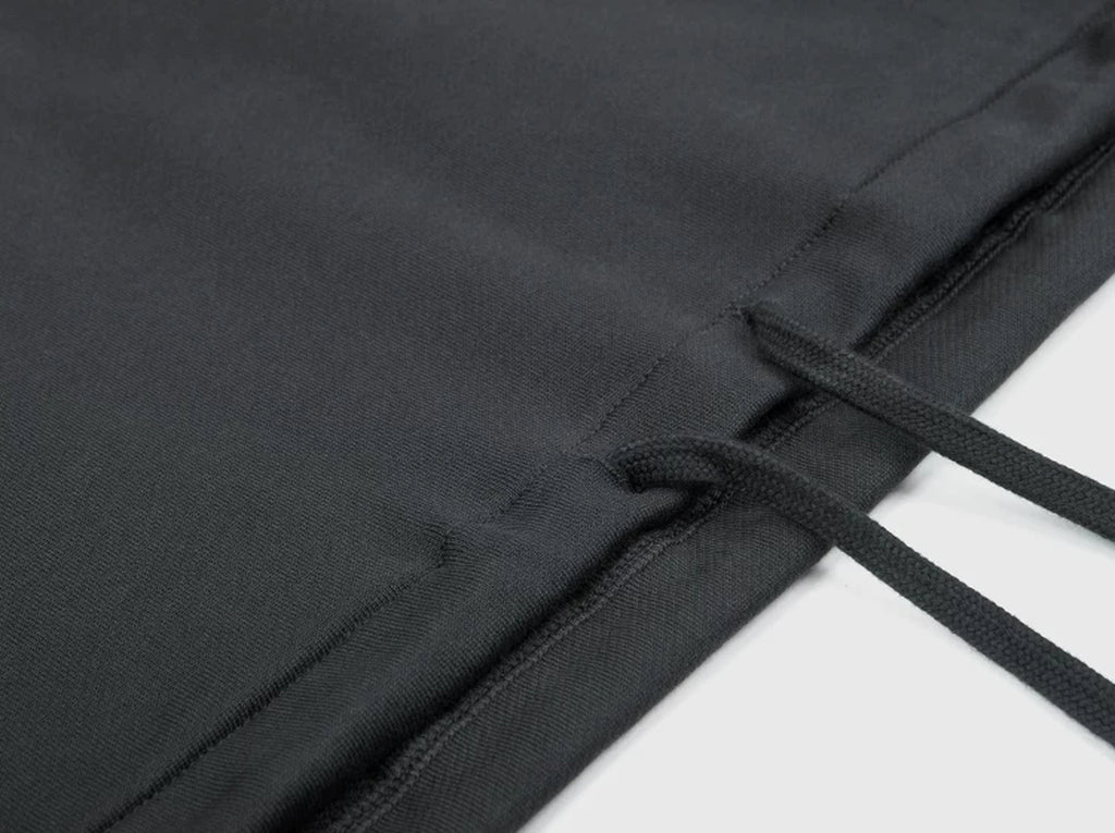IDLT half zip sweatshirt, dark gray hem drawstrings.