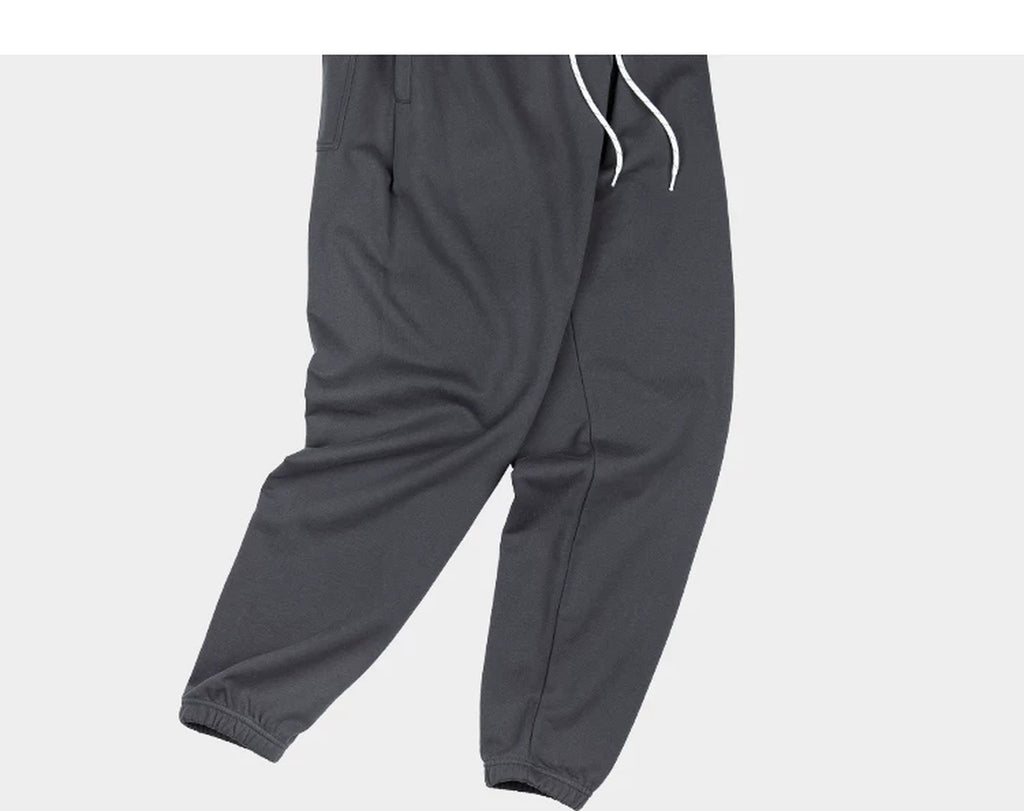 IDLT joggers, dark gray draped legs.
