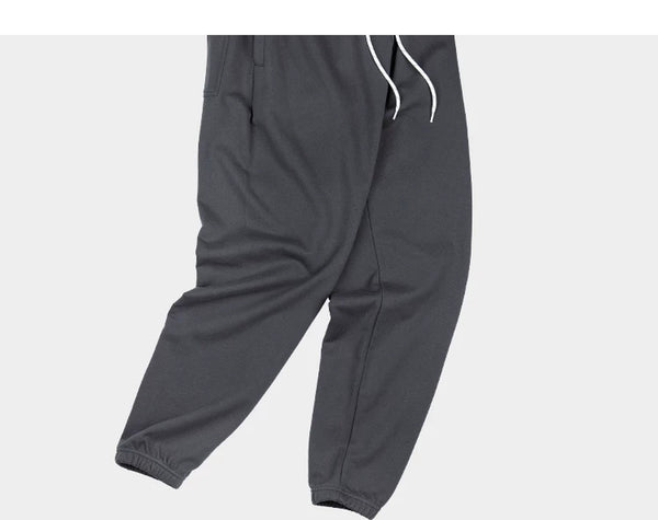 IDLT joggers, dark gray draped legs.
