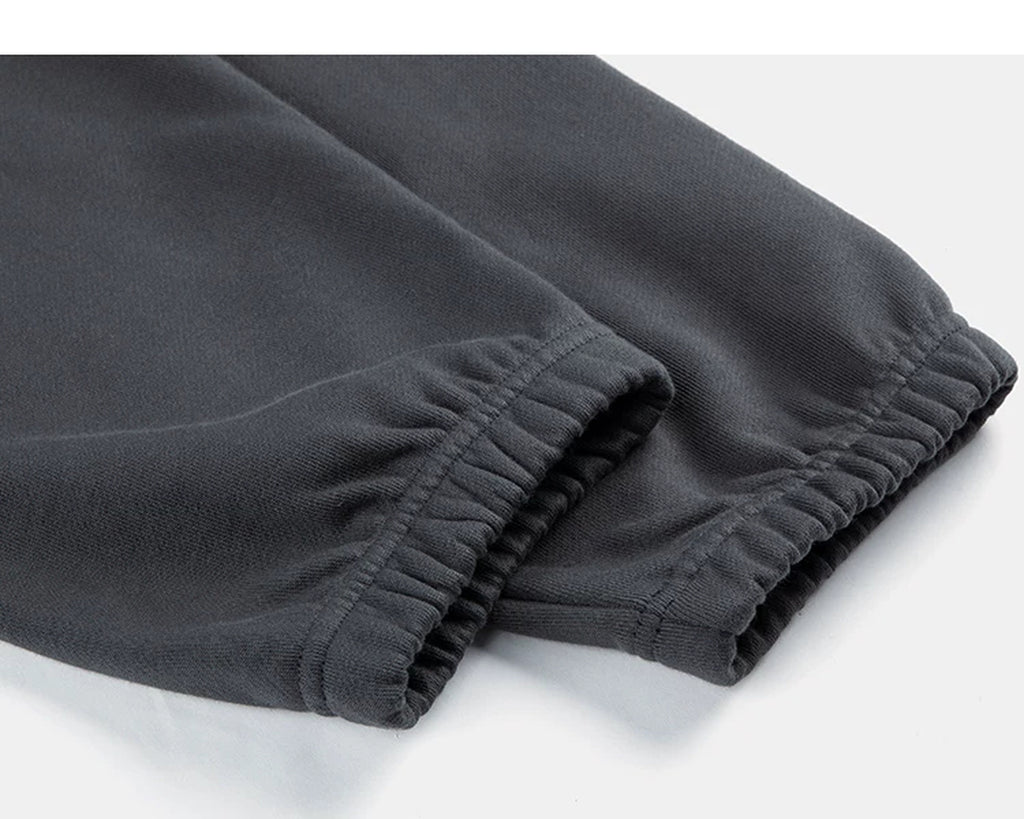 IDLT joggers, dark gray elastic ankle cuffs.