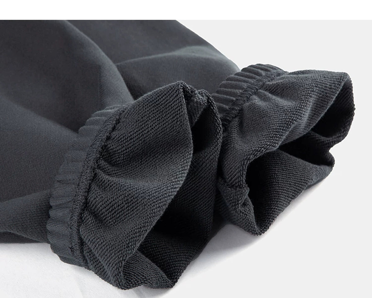 IDLT joggers, dark gray turned ankle cuffs.