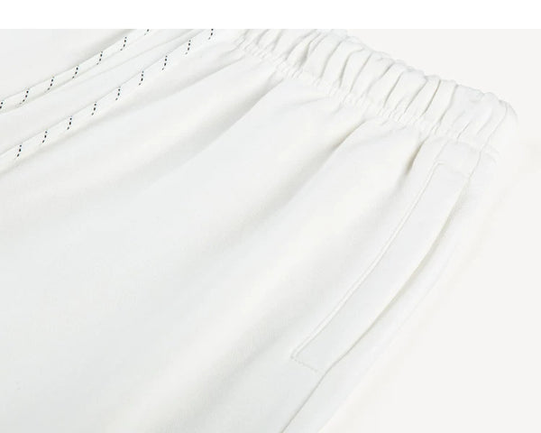 IDLT joggers, white waistband and side pocket.