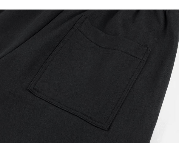 IDLT joggers, black back pocket.
