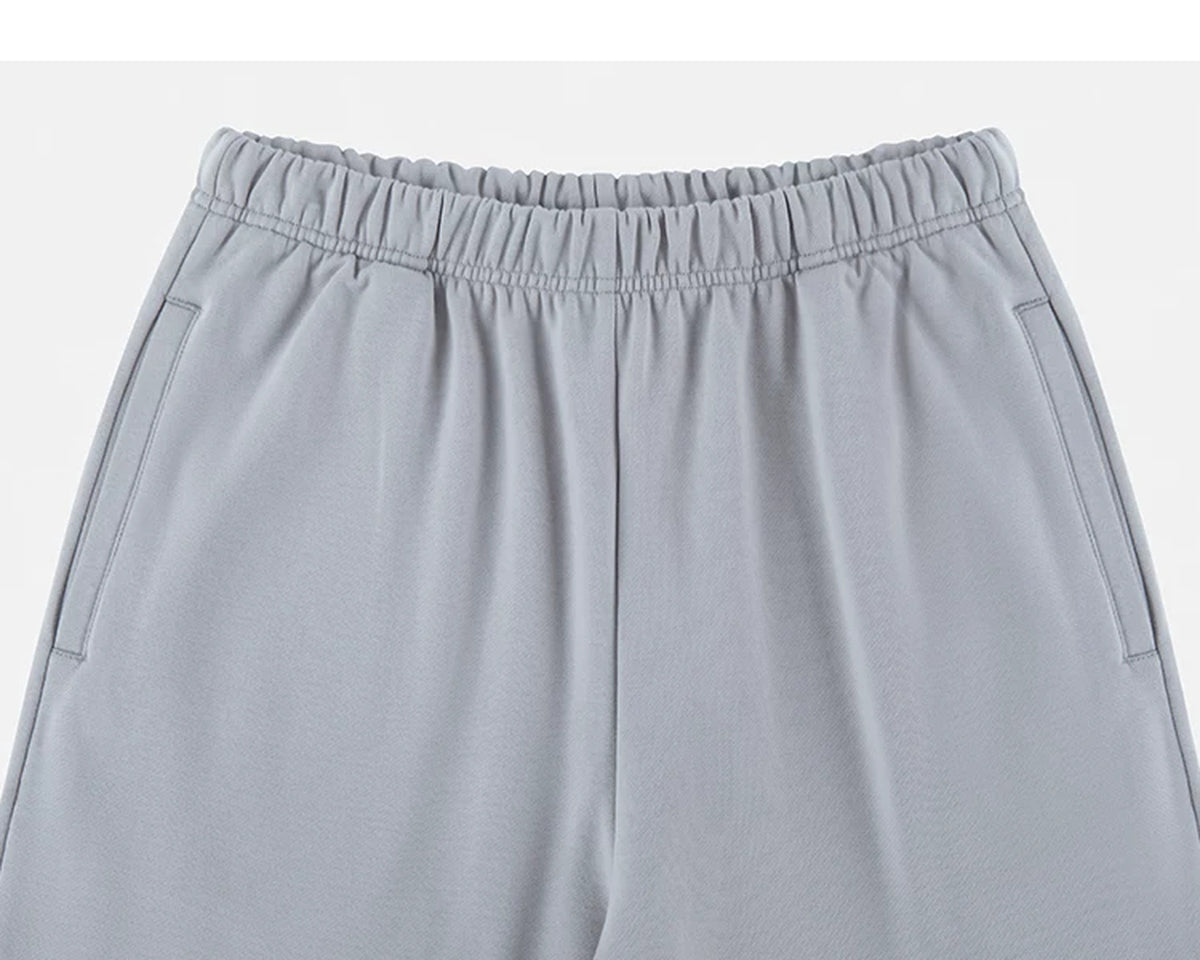 IDLT wide leg sweatpants, light gray waistband and pockets.