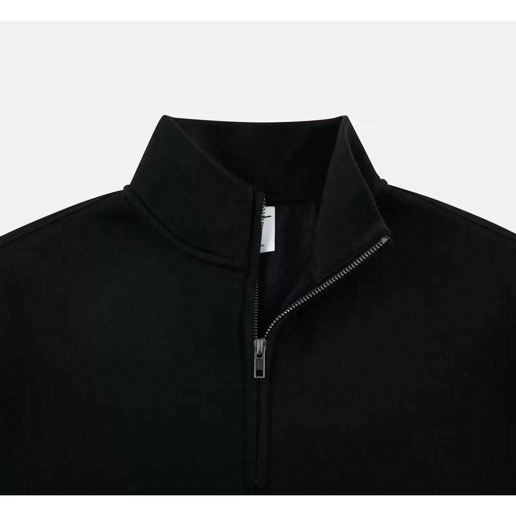 IDLT half zip sweatshirt, black open collar.