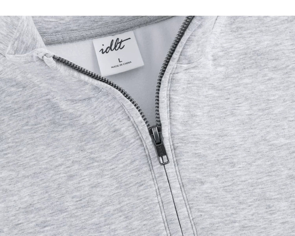 IDLT half zip sweatshirt, heather gray open zipper and label.