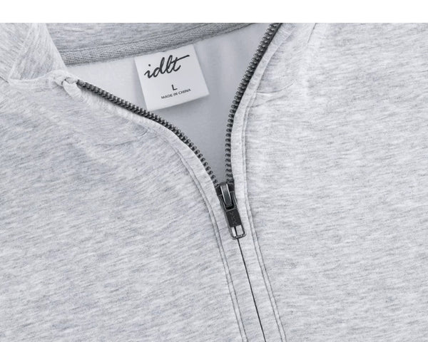 IDLT half zip sweatshirt, heather gray open zipper and label.
