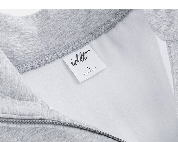 IDLT half zip sweatshirt, heather gray inner neckline label.