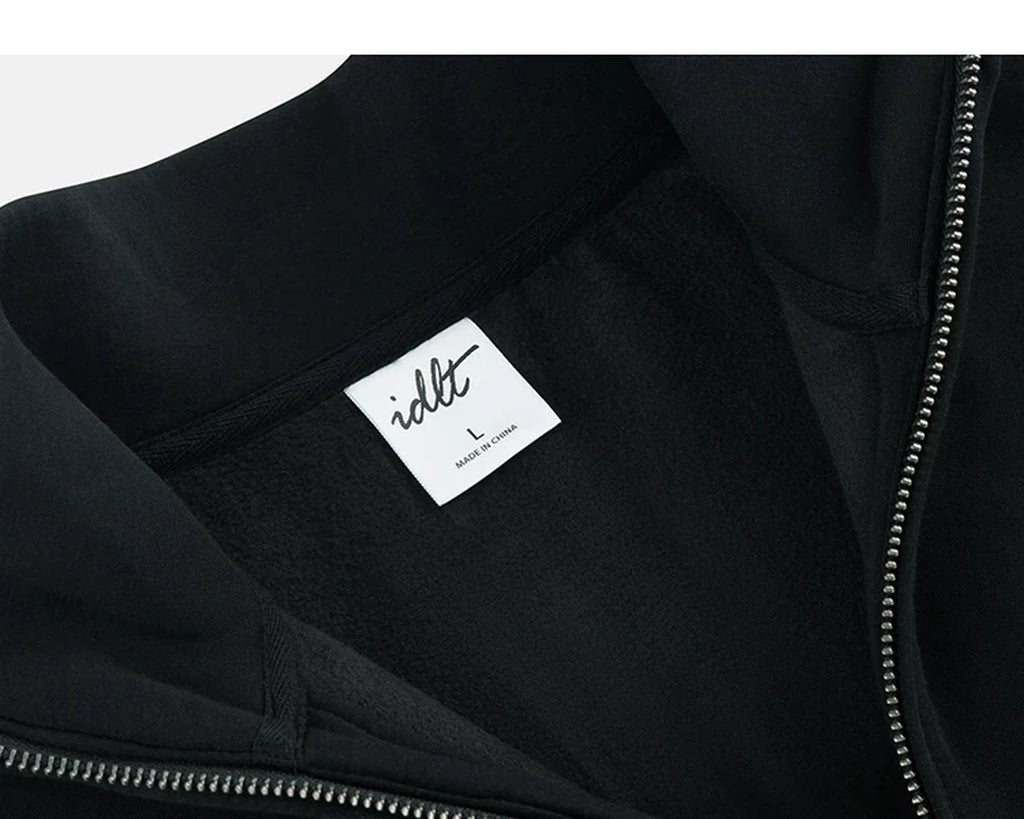 IDLT half zip sweatshirt, black inner neckline label.