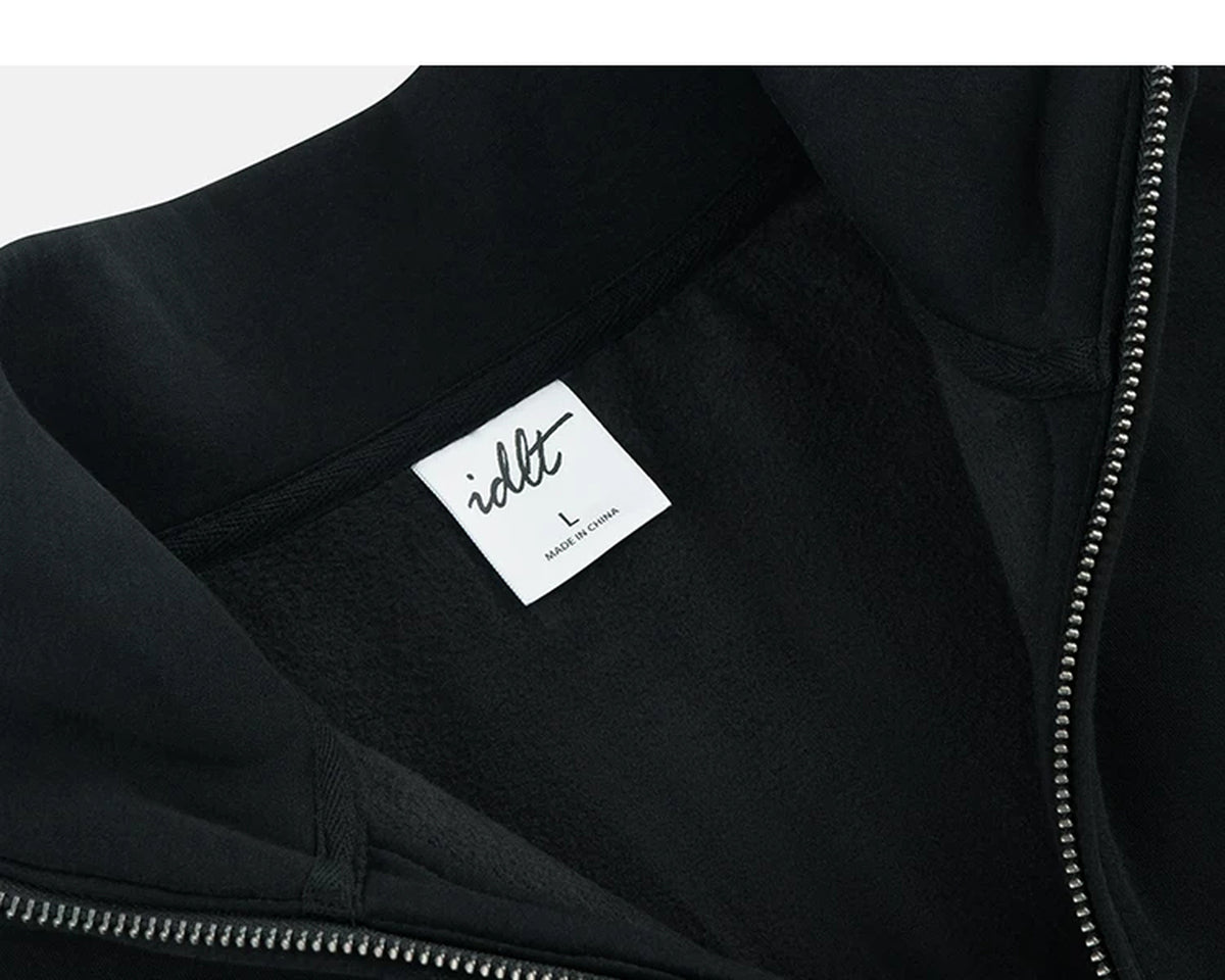 IDLT half zip sweatshirt, black inner neckline label.