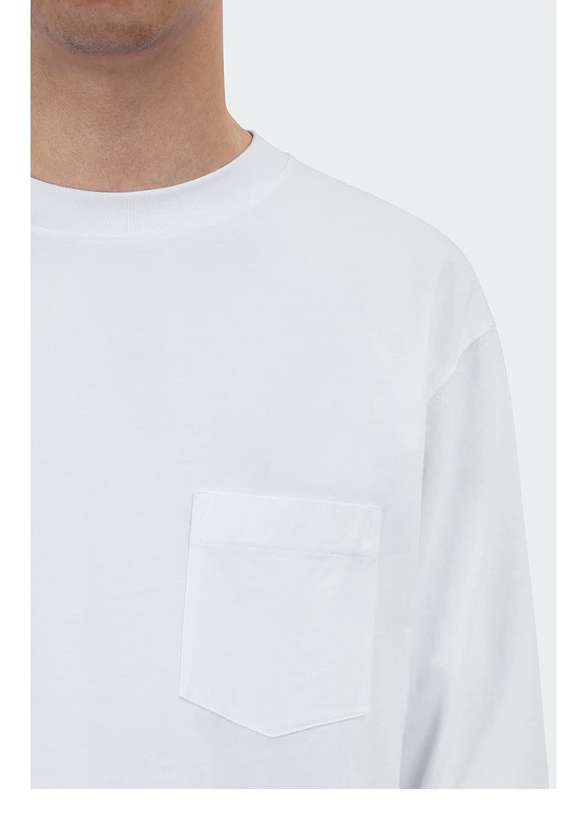 IDLT long sleeve pocket T-shirt, white chest pocket on model.