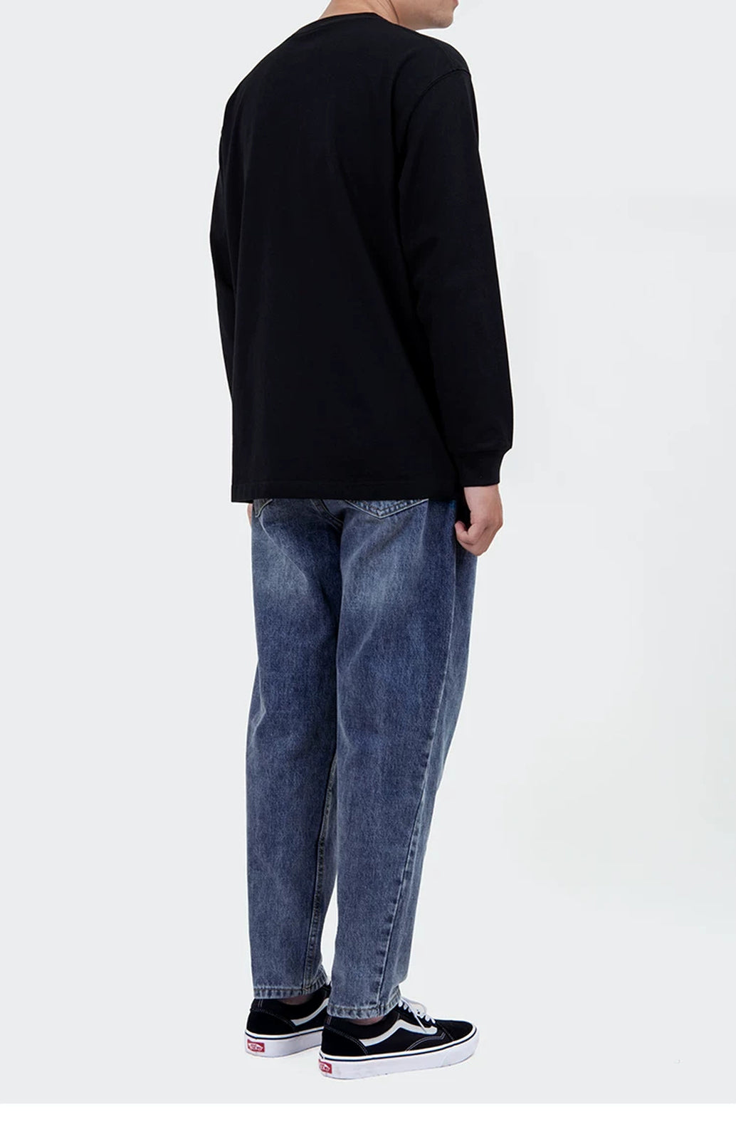 IDLT long sleeve pocket T-shirt, black rear three-quarter view on model.