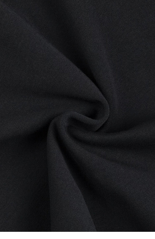 IDLT mock neck top, black gathered fabric texture.