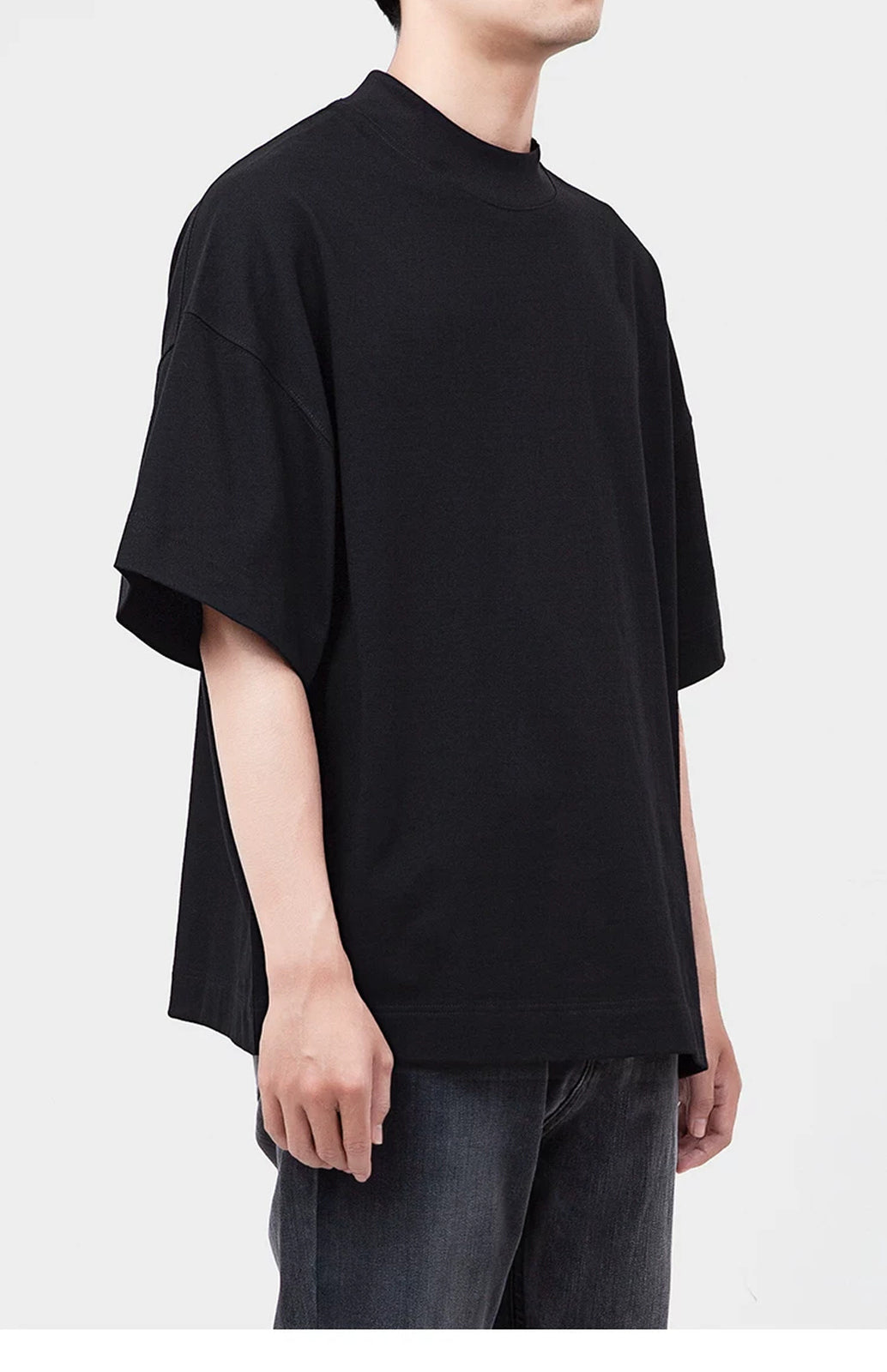 IDLT T-shirt, black side view on model.