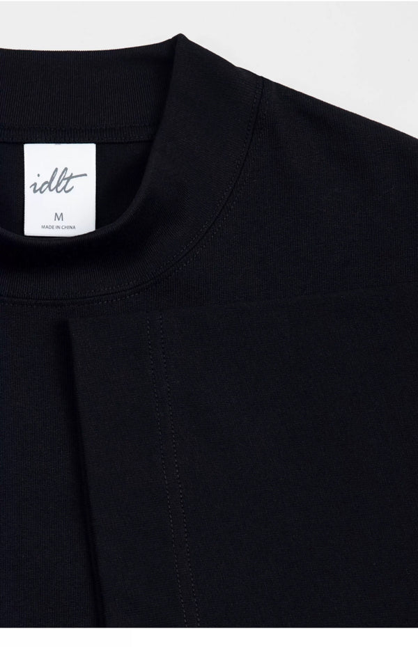 IDLT T-shirt, black neckline and label.