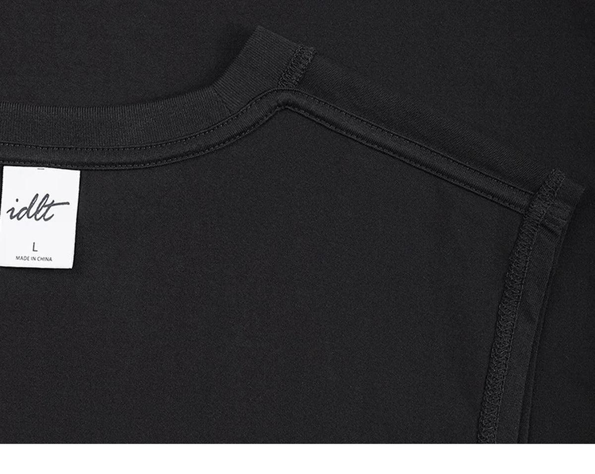 IDLT sleeveless T-shirt, black inner neckline and label.