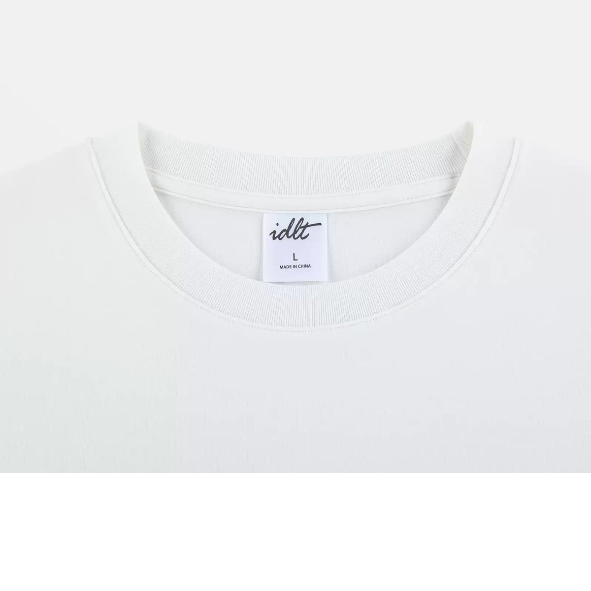 IDLT T-shirt, white neckline close-up.