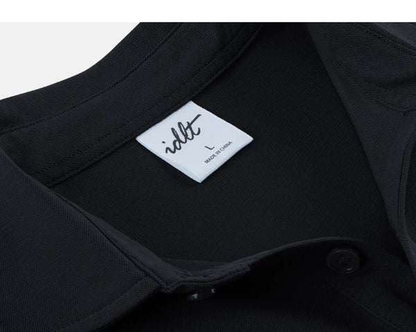 IDLT polo shirt, black neckline label.