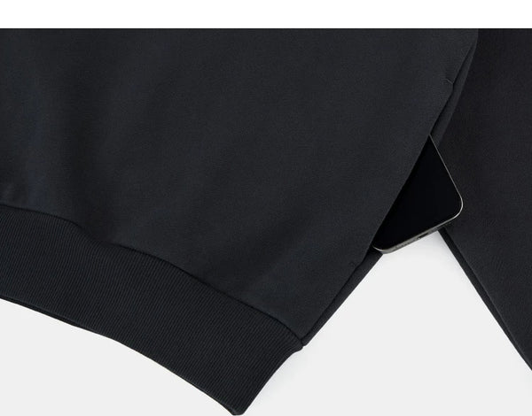 IDLT hoodie, black side pocket.