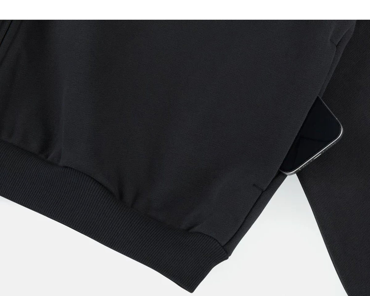 IDLT zip hoodie, black side pocket.