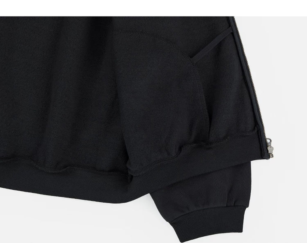 IDLT zip hoodie, black inner hem construction.