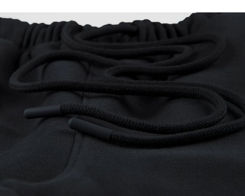 IDLT wide leg sweatpants, black drawstring tips.