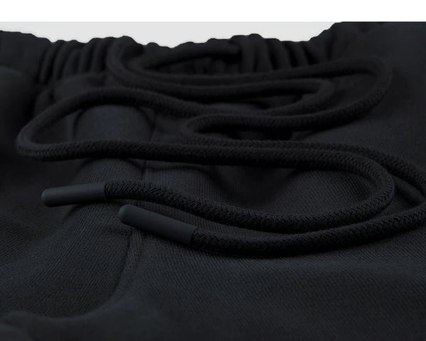 IDLT wide leg sweatpants, black drawstring tips.