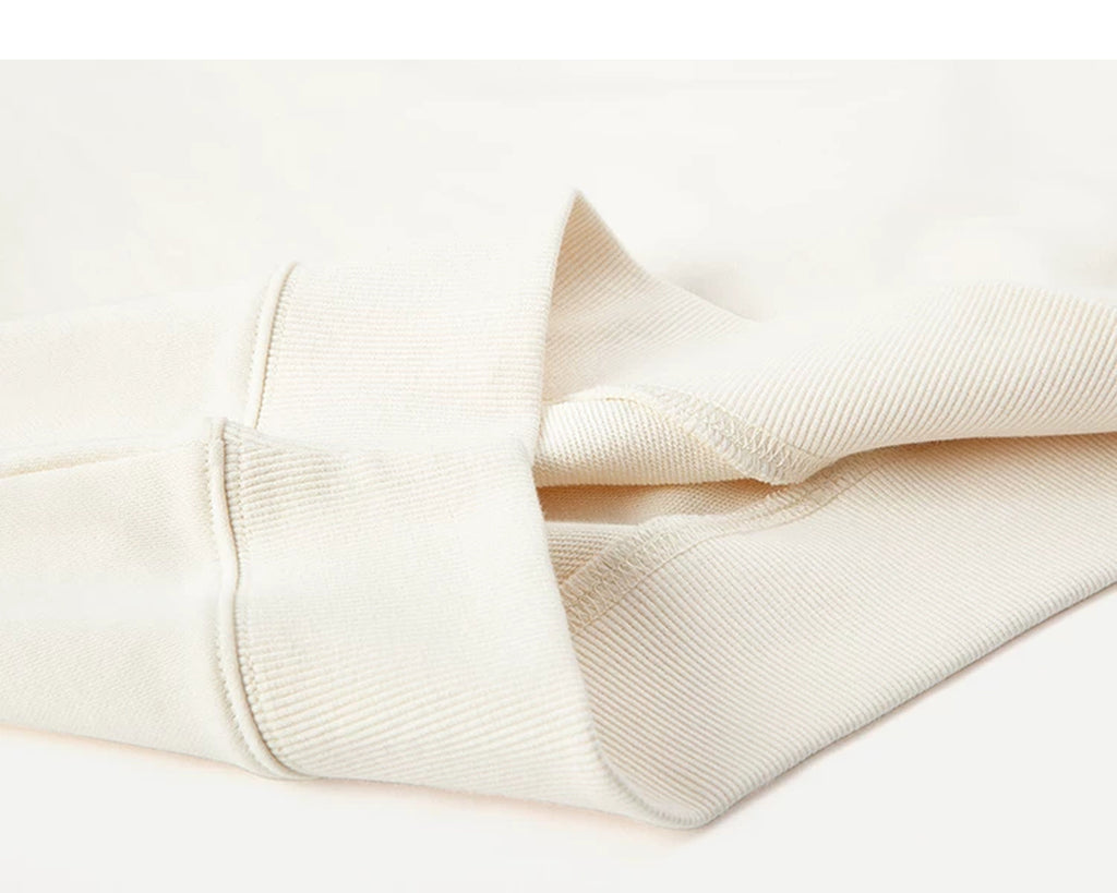 IDLT short sleeve sweatshirt, cream folded ribbed hem.