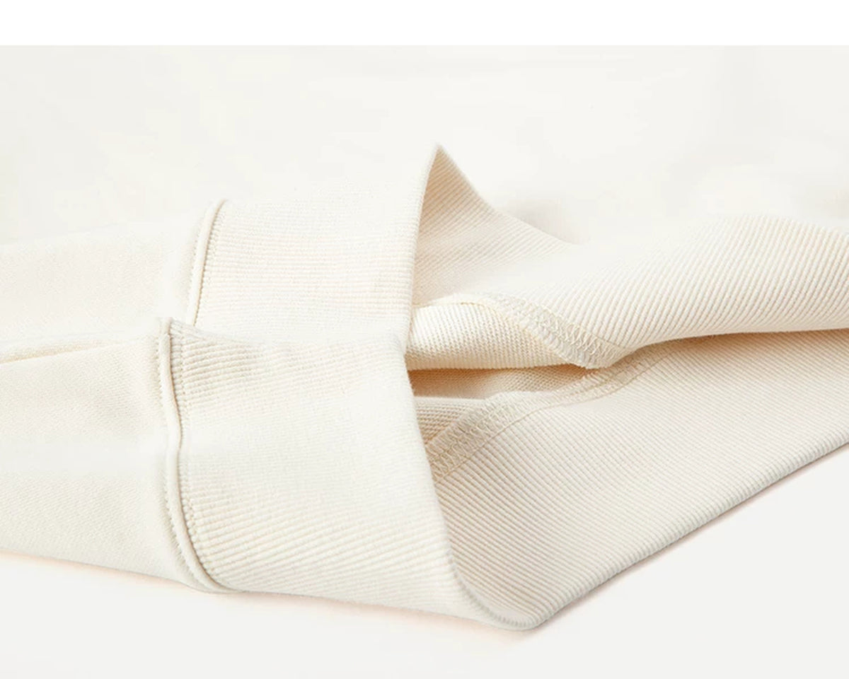 IDLT short sleeve sweatshirt, cream folded ribbed hem.