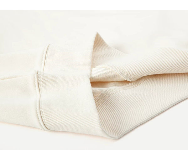 IDLT short sleeve sweatshirt, cream folded ribbed hem.