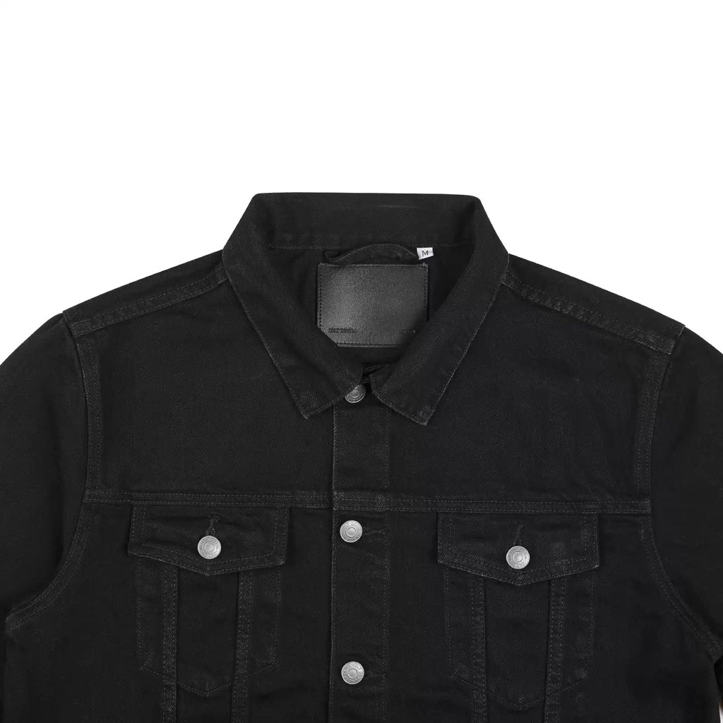 IDLT denim jacket, black collar and chest pockets.