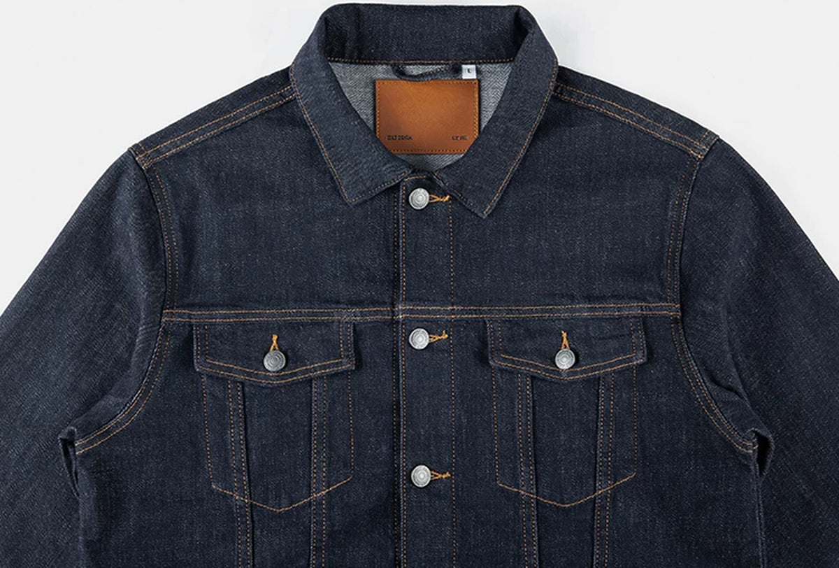IDLT denim jacket, dark blue collar and chest pockets.