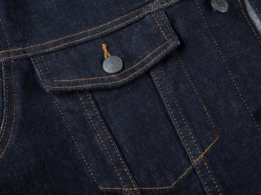 IDLT denim jacket, dark blue chest pocket stitching.