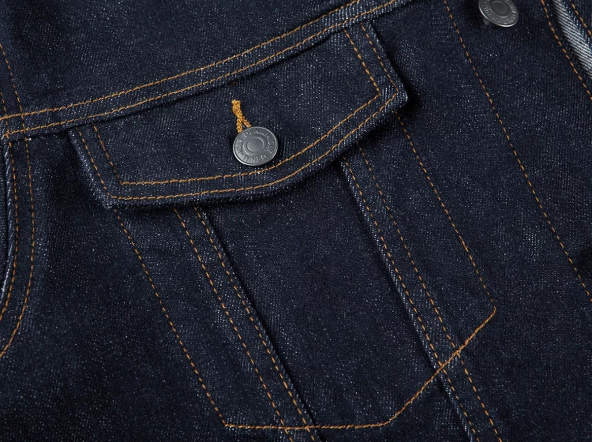 IDLT denim jacket, dark blue chest pocket stitching.