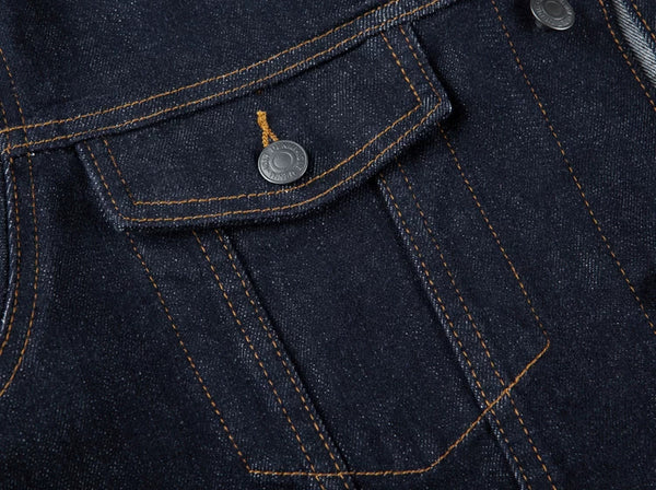 IDLT denim jacket, dark blue chest pocket stitching.